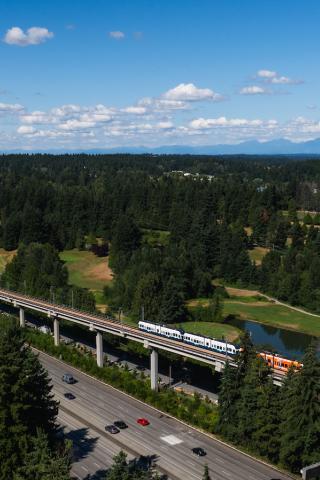 A drone shot of a train leaving Pinehurst station
