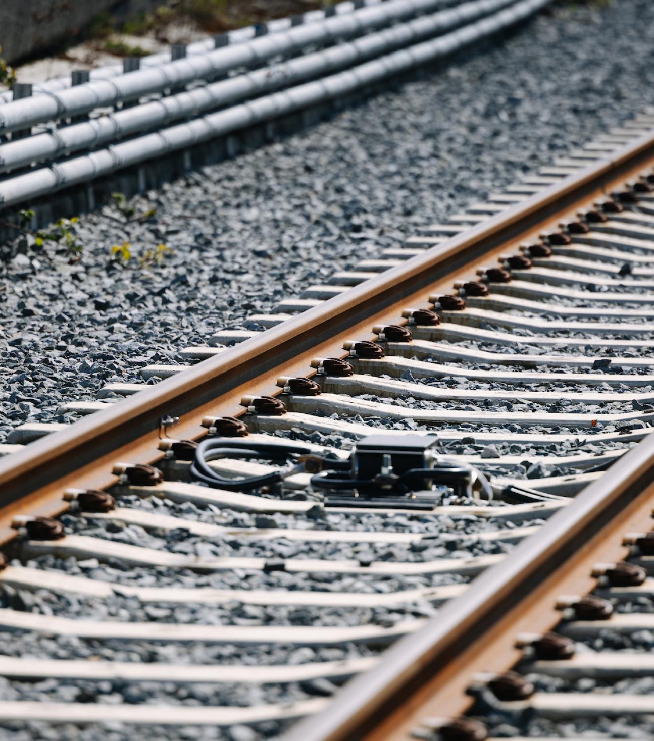 Header image depicting light rail tracks.