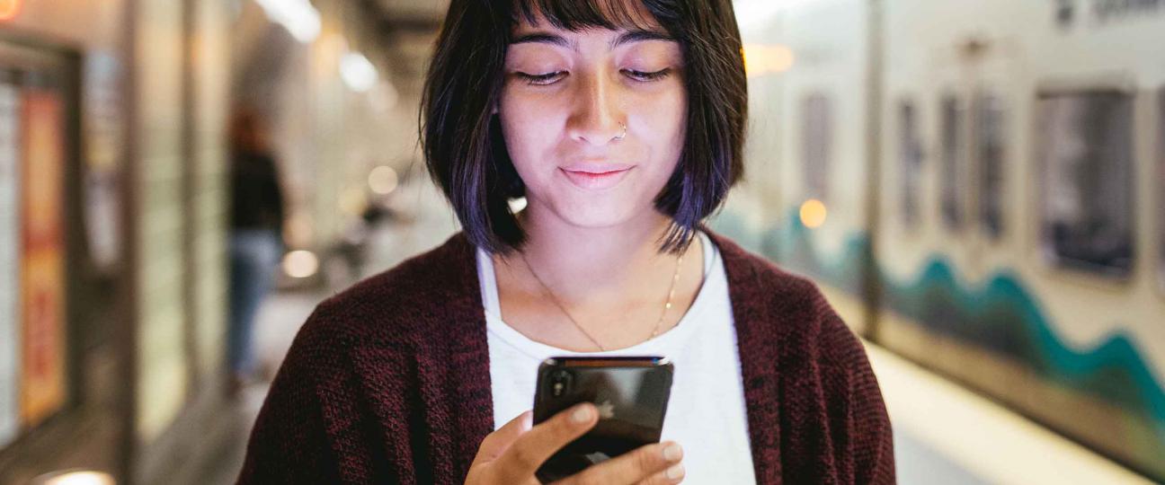 The Platform Blog - Sound Transit rider on mobile device at Beacon Hill Station