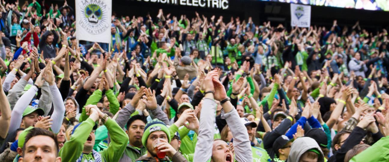 Fans cheer at a Sounders FC match.