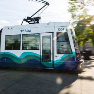 A T Line train moves through the city of Tacoma.