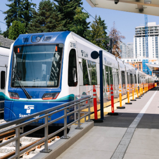 Transit workers perform testing on the new 2 Line in Bellevue with two Link light rail trains.