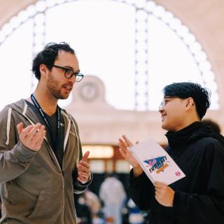 Attendees of the Sound Transit Youth Conference chat inside The Great Hall at Union Station.