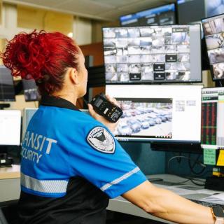 A worker monitors Sound Transit stations from a desk.