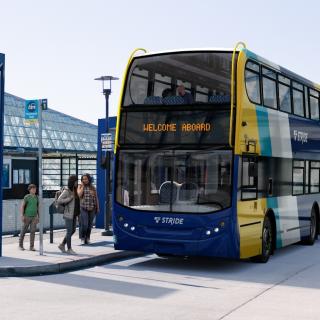 A rendering of a Stride bus at a station.