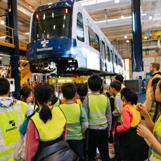 Students on a tour of an OMF