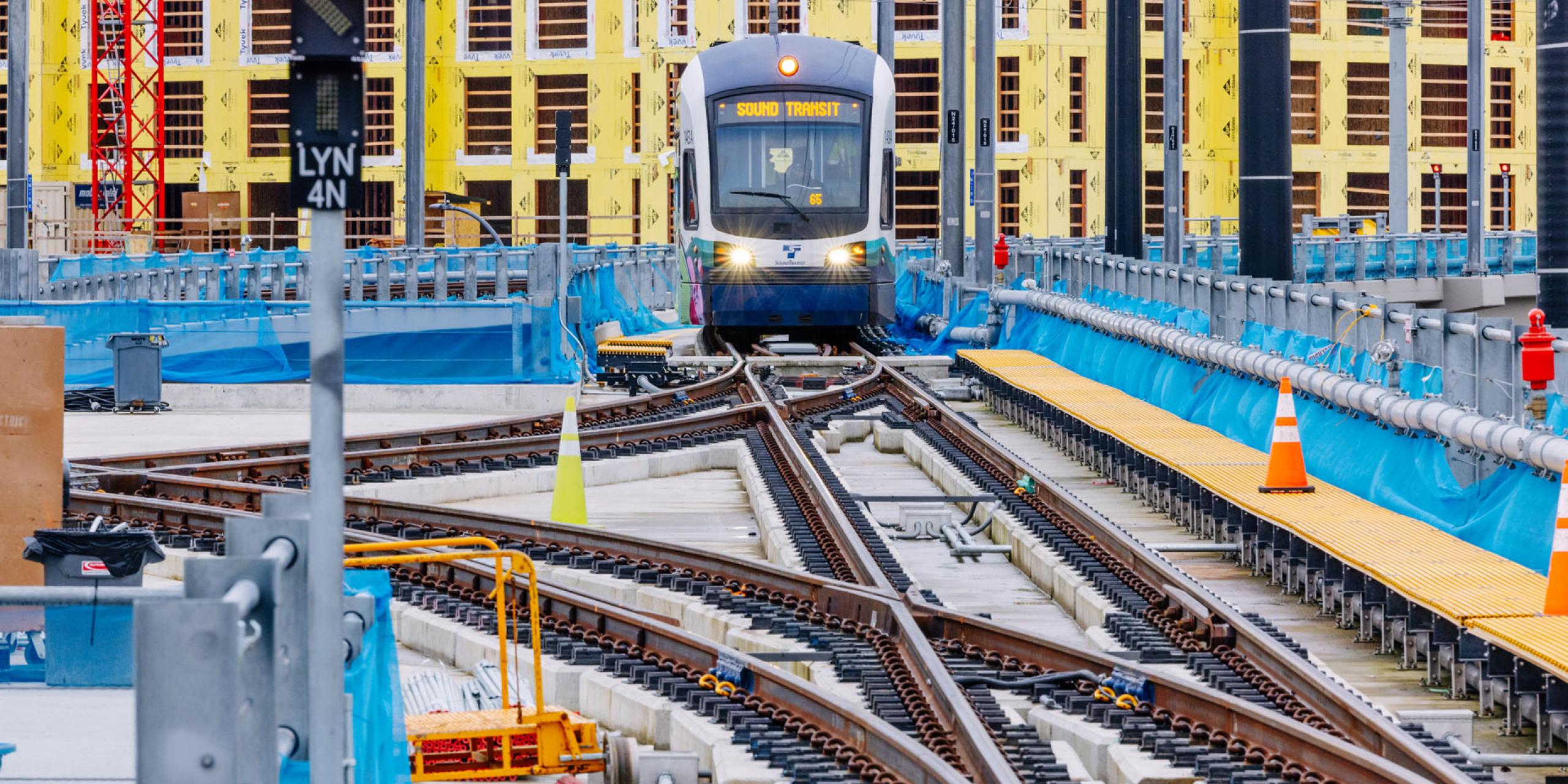 A light rail train in Lynnwood with construction in the background.