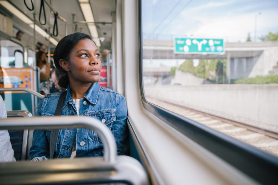 Passenger looks out the window while riding the Link light rail.