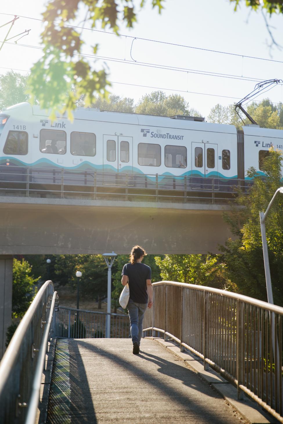 2018 in review: a rider approaches the Mt. Baker Link Station from the pedestrian overpass in the fall sun. 