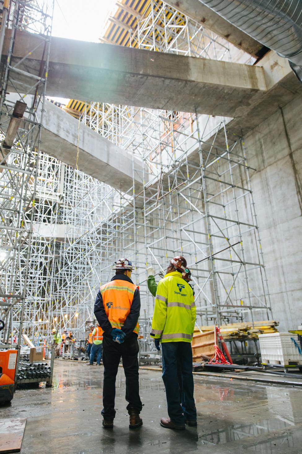 2018 in review: workers look up from the platform at the future U District Station, about 80 feet below ground.