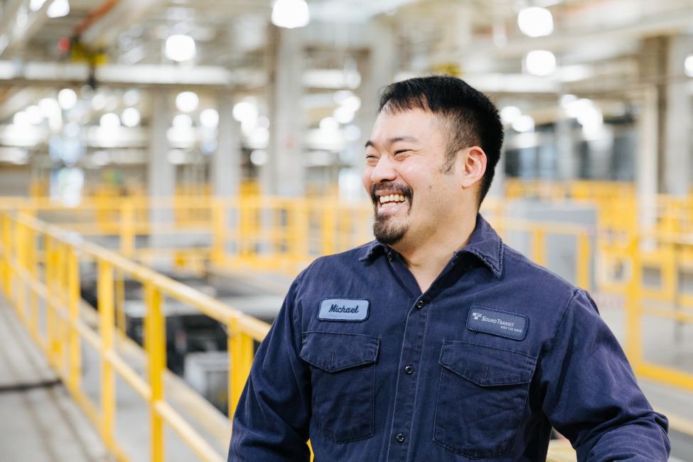 A smiling worker at the Link Operations and Maintenance Base