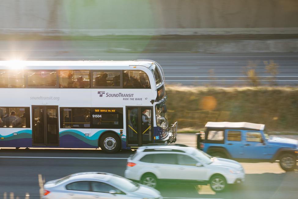 2018 in review: the morning sun glistens off a Sound Transit Express double-decker bus.