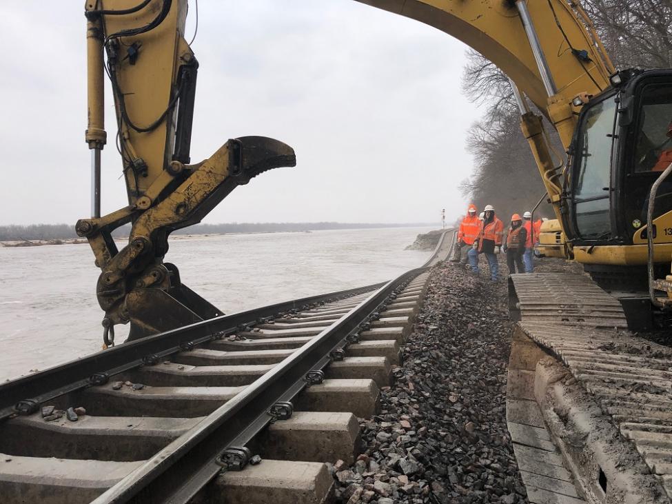 Burlington Northern Santa Fe workers repair a section of track along the flooded Missouri River. Photo courtesy BNSF.