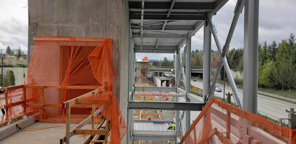 This is a look inside the 77th Avenue Southeast entrance looking east with the elevator shaft to the left, stairs in the center and the escalator will be to the right.