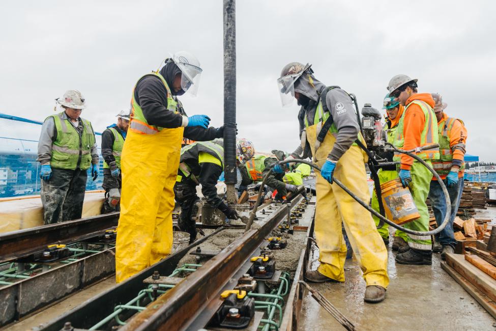 Crews install rail near the future Northgate Station site. 