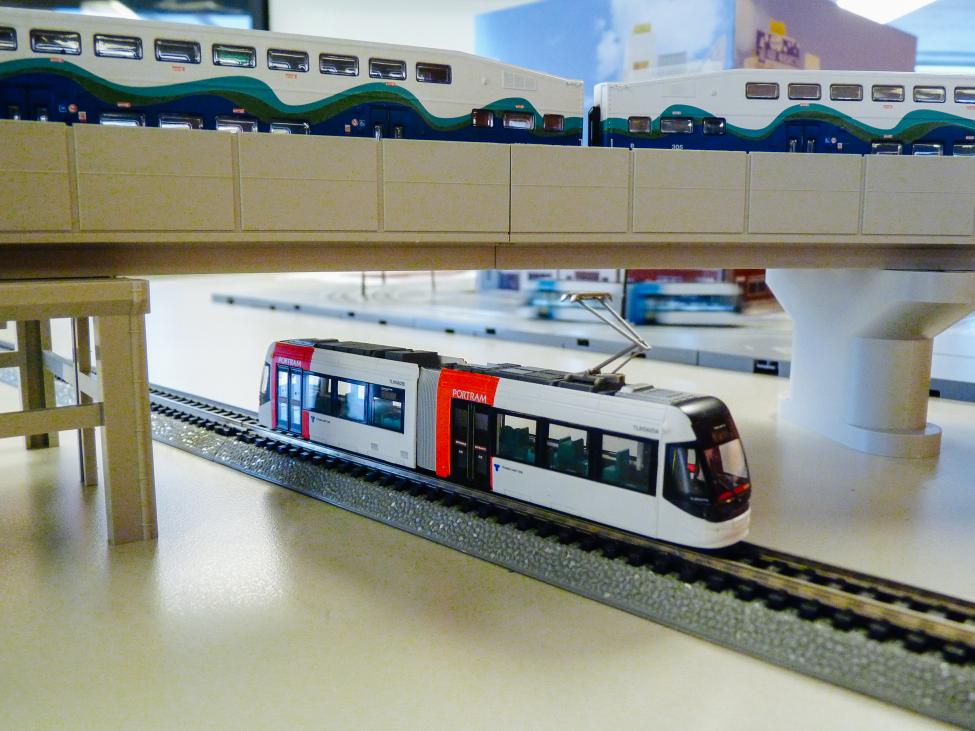 A model Sounder train and light rail car that are part of Mak's immense collection of model trains, buses and planes.