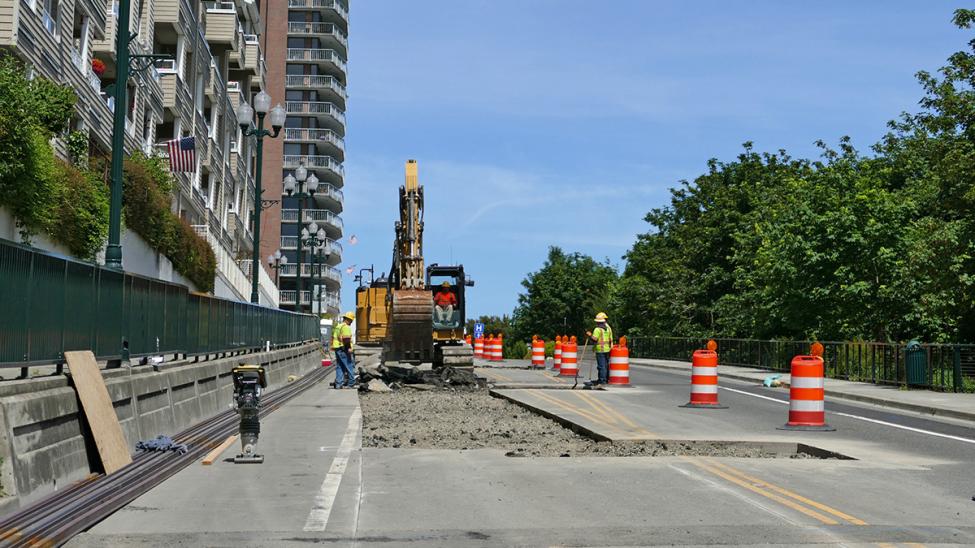 Contractors preparing Stadium Way for track installation.