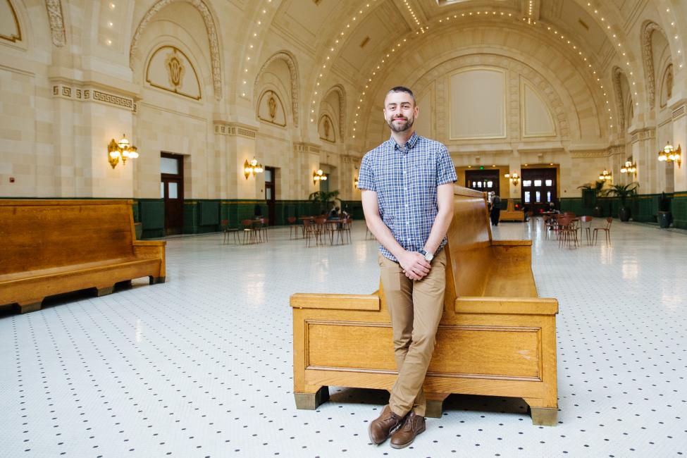 Adam Vance pauses at work in the Joni Earl Great Hall at Sound Transit Headquarters