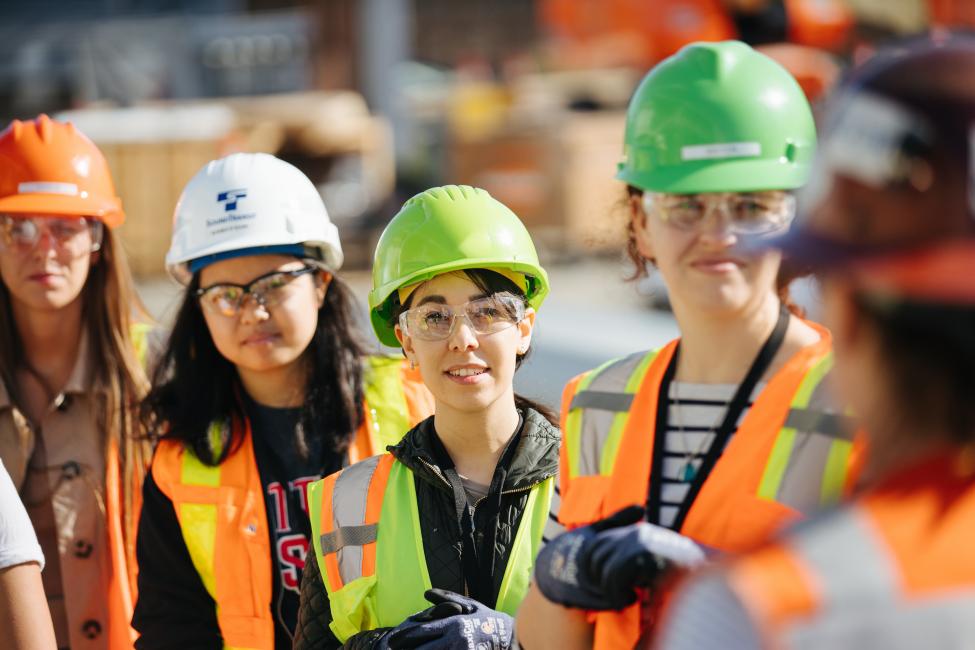 Asela Chavez-Basurto and other interns tour the construction site at Northgate Station.