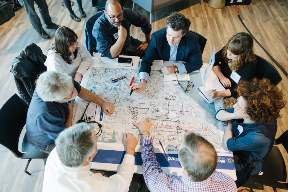 Community members discuss the West Seattle-Ballard light rail extension at an open house.