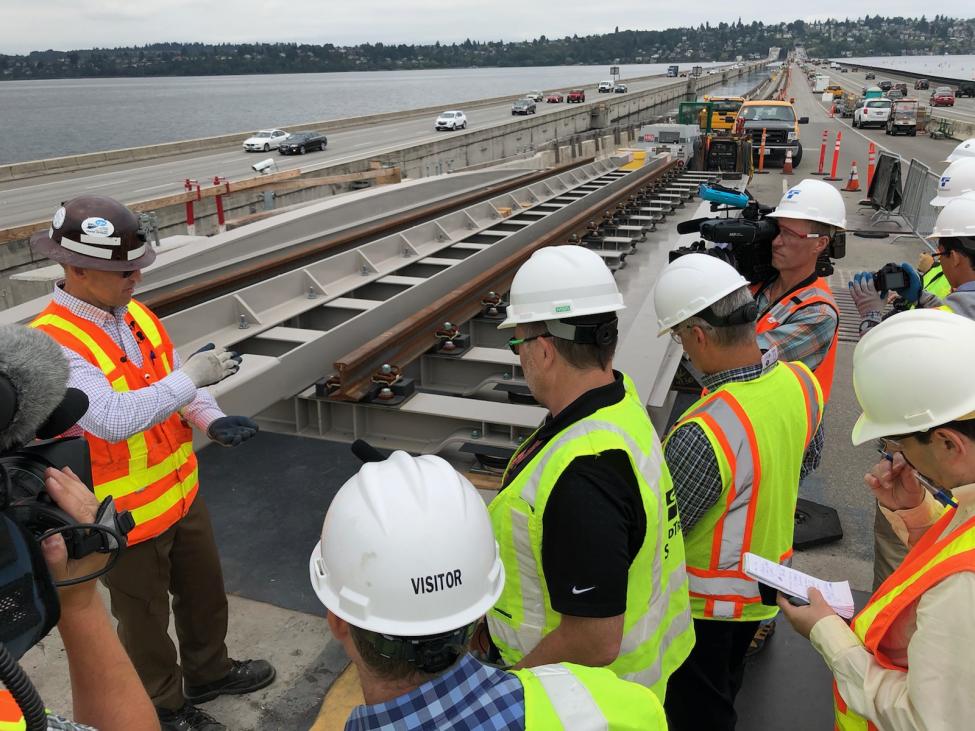Sound Transit staff explain to media how rails will be installed on the I-90 bridge.