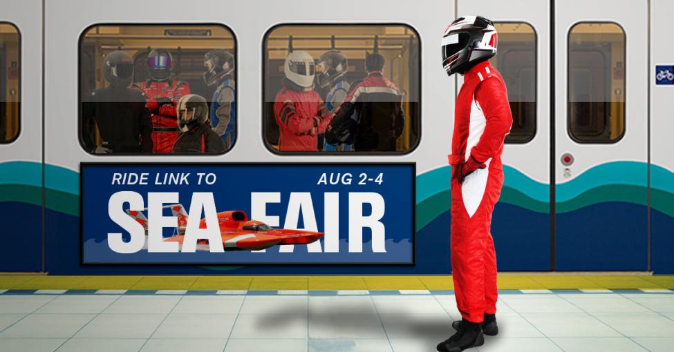 A helmeted hydroplane driver waits to board a Link light rail train where several other drivers are already on board.