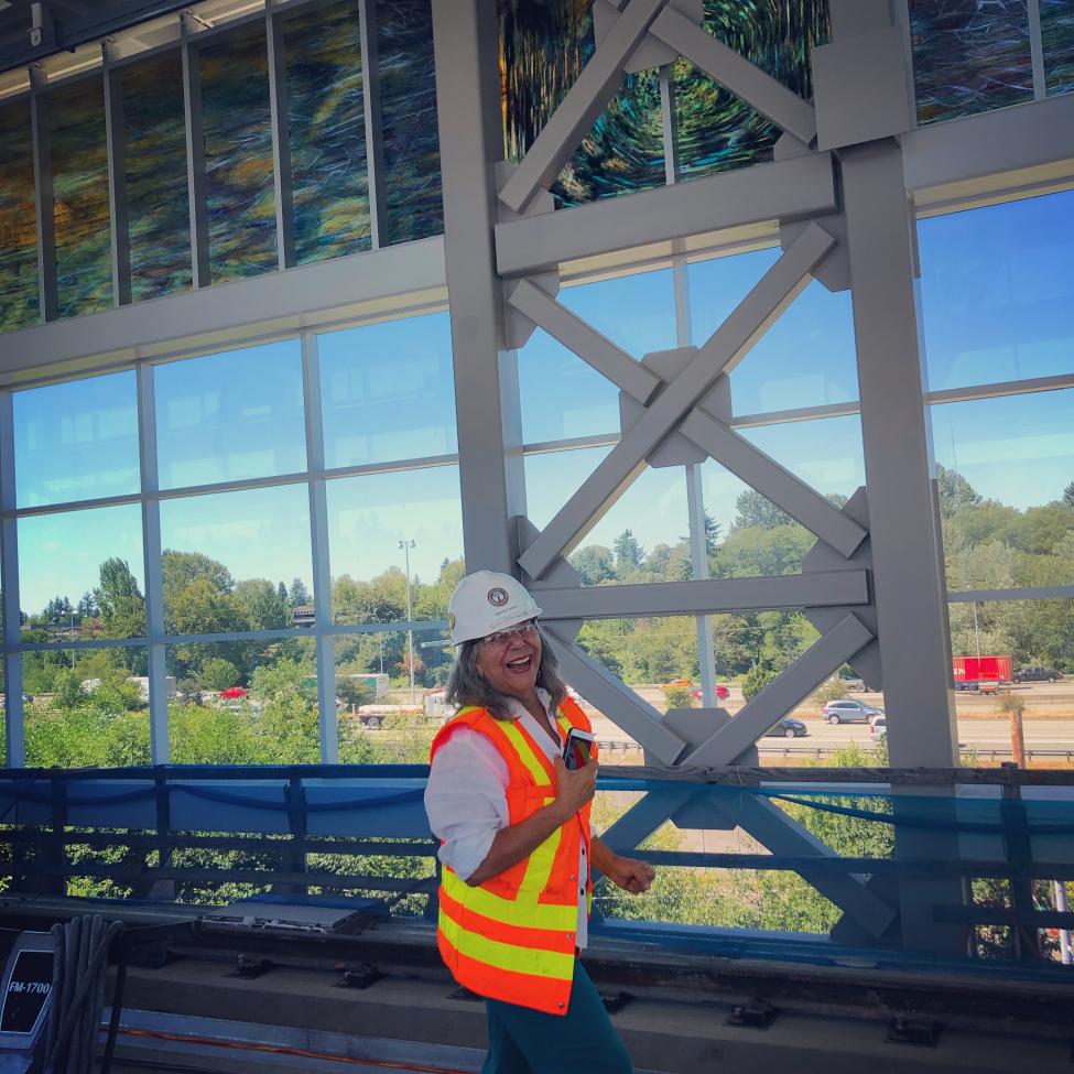 Artist Mary Ann Peters checks out her work at Northgate Station.