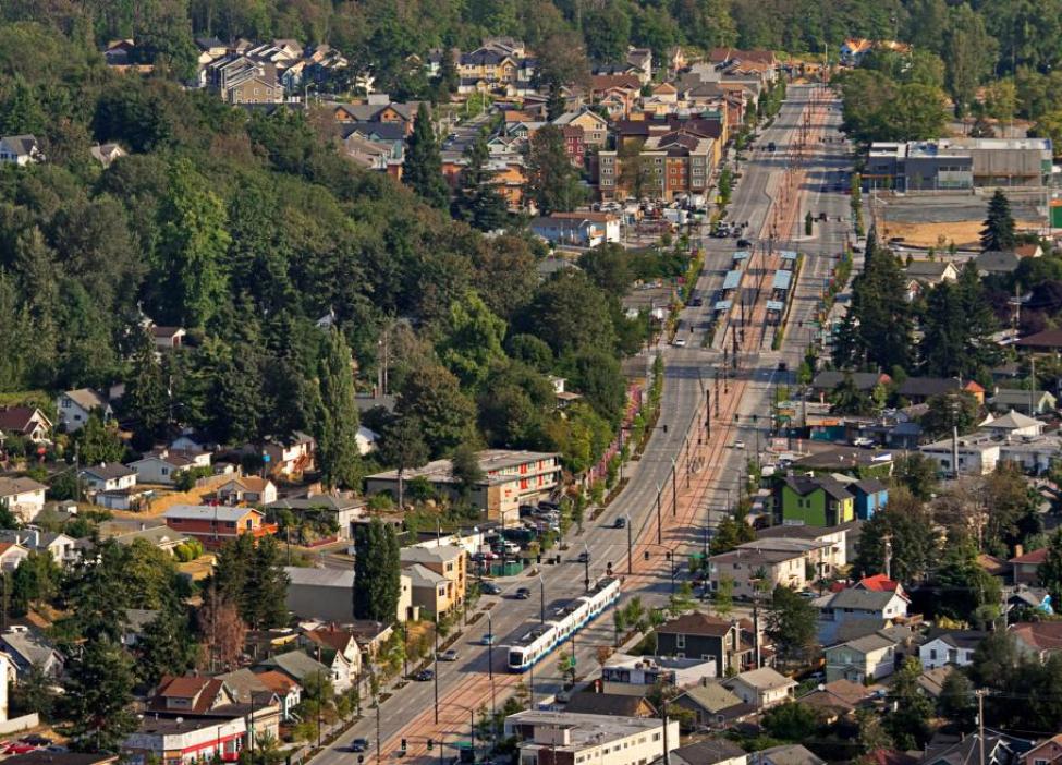 An aerial shot of Link light rail running through Seattle's Rainier Valley.