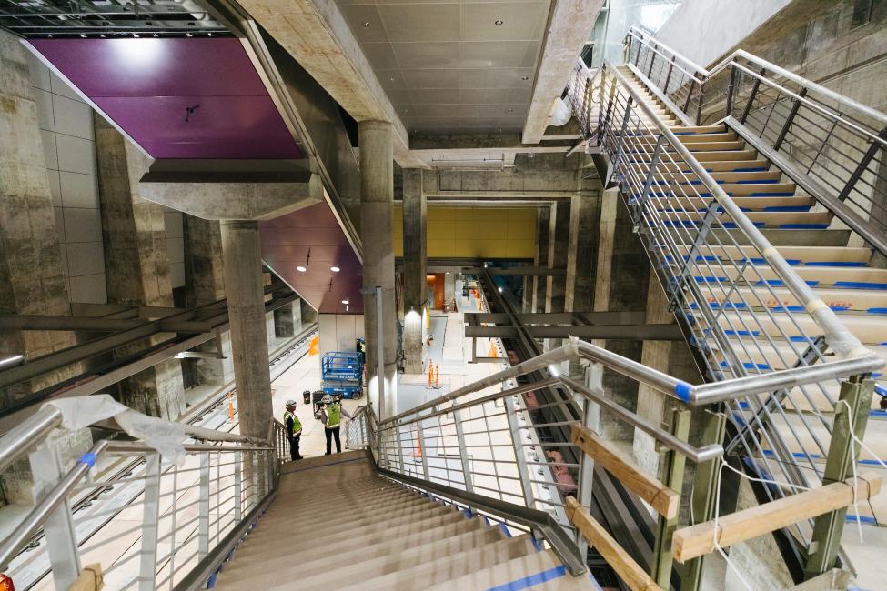 A view of the platform at Roosevelt Station, looking down from the stairs coming from the mezzanine level.