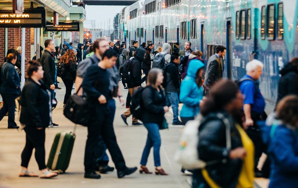 Passengers board a Sounder train.