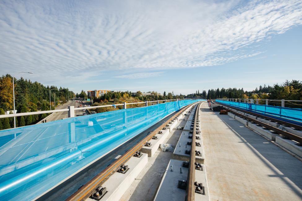 A light rail bridge crosses over 148th Avenue in Redmond.