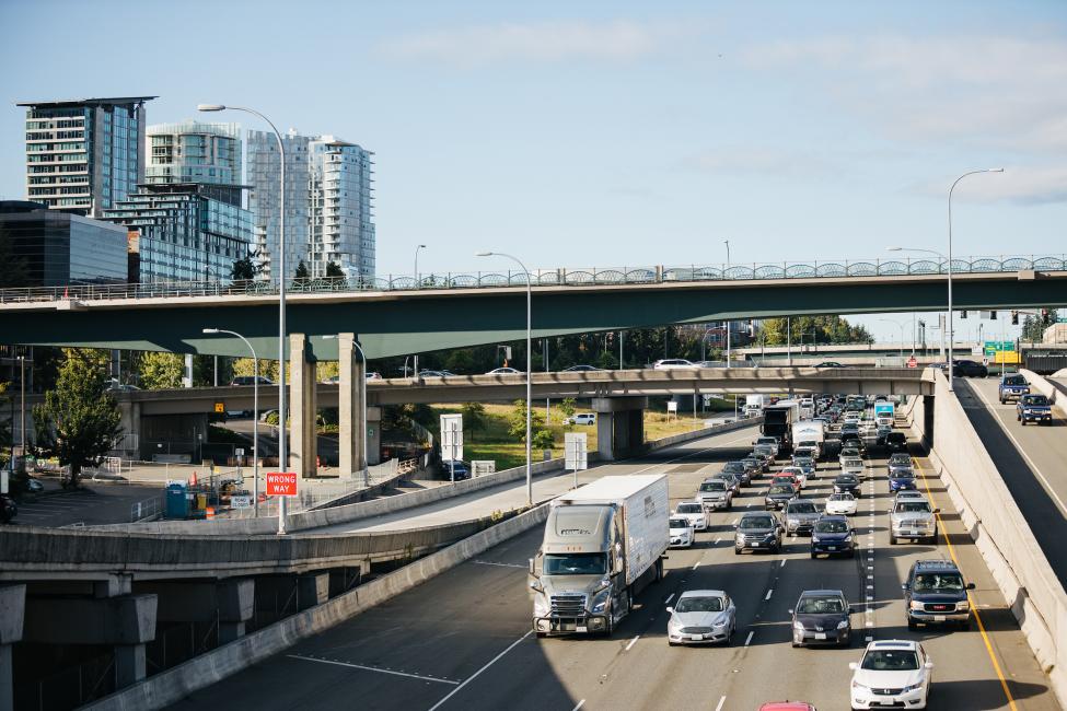 Cars drive on southbound I-405, under the new light rail bridge in downtown Bellevue. 