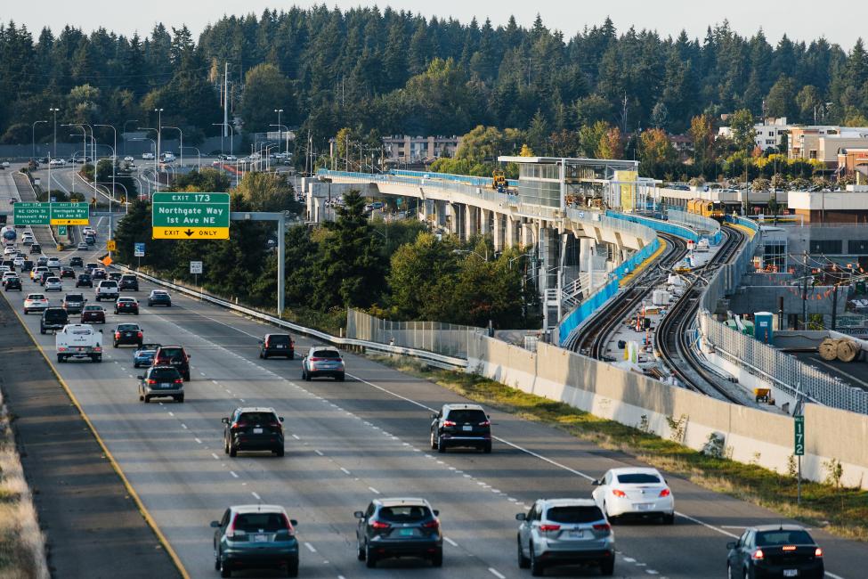 A view of I-5 north with the Northgate Station under construction on the right side.