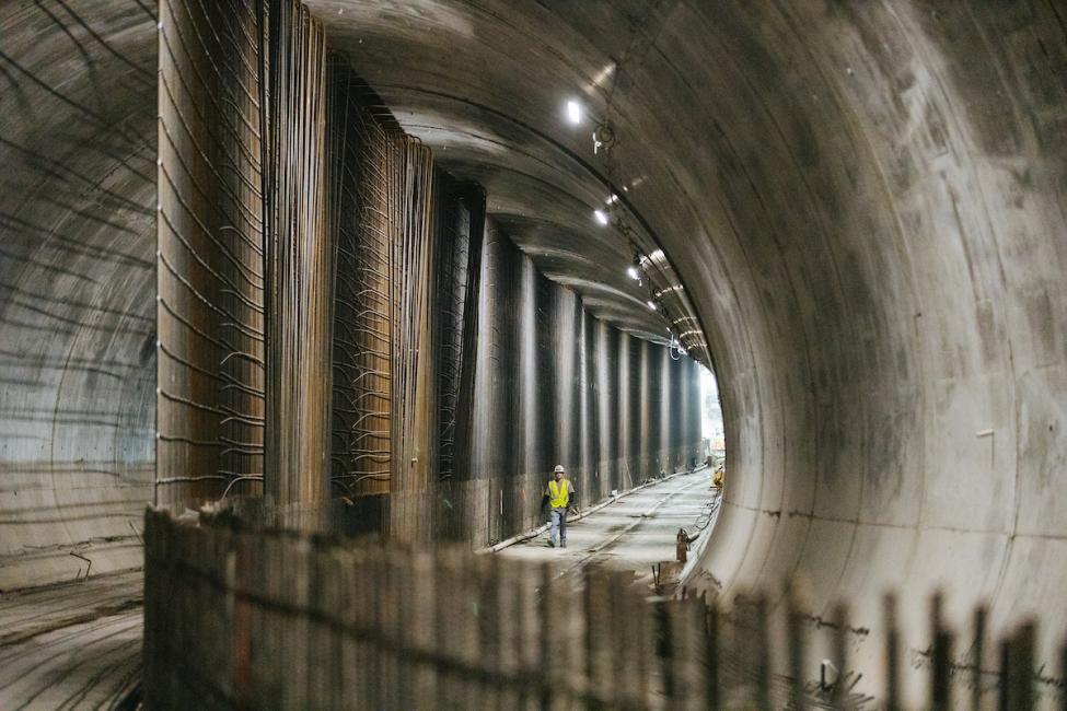 Construction worker walks under downtown Bellevue in the new light rail tunnel.