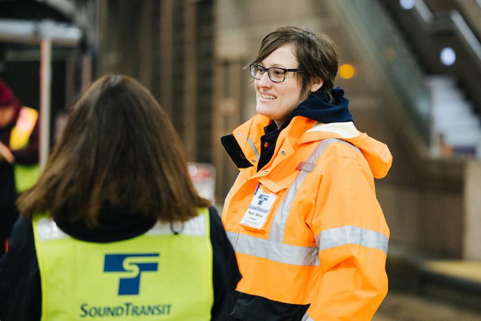 Executive Operations Director Marie Olson talks with staff at the Pioneer Square Station center platform.