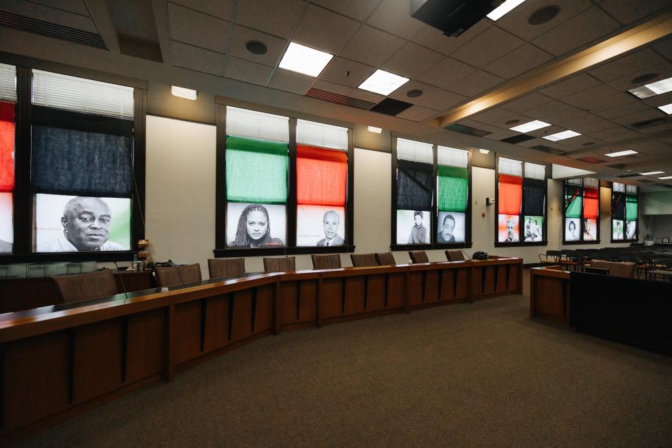 Photos of African American icons adorn the walls of the Sound Transit boardroom.