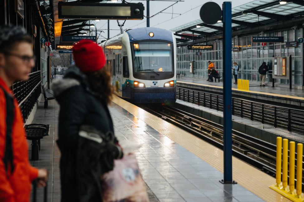 A rider waits for the train on the southbound platform at Mount Baker Station.