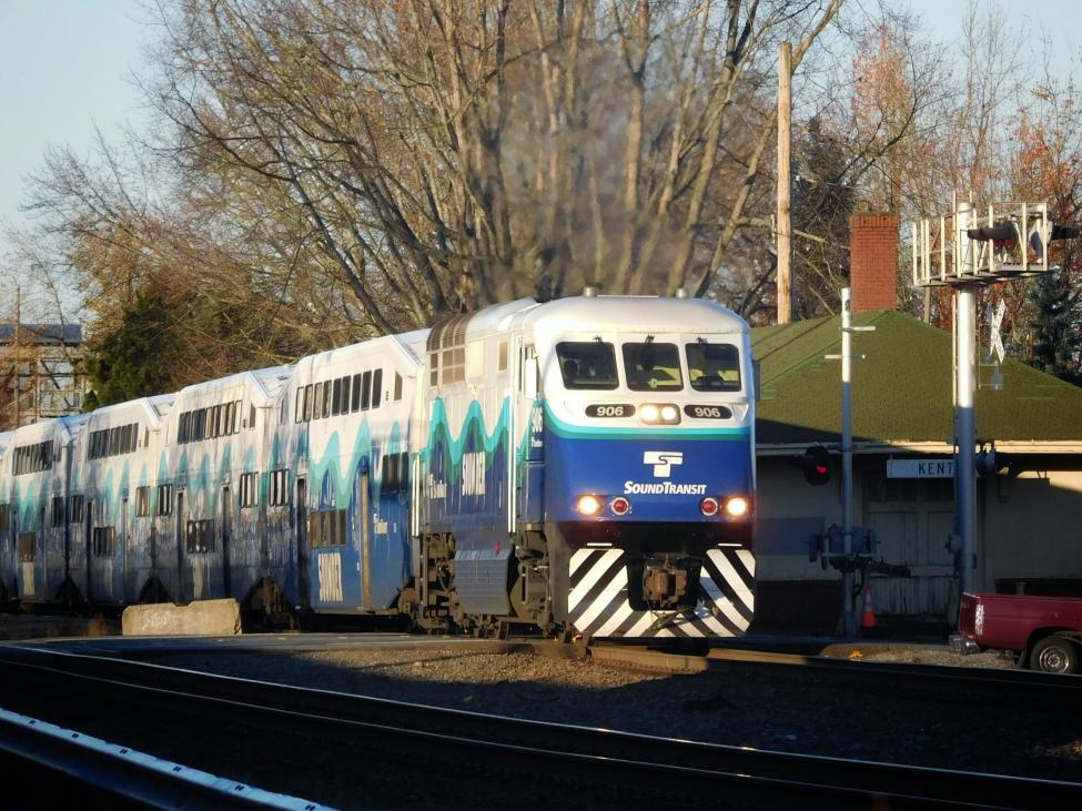 Sounder train with trees in the background.