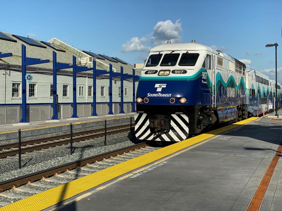 A Sounder train pulls into Tacoma Dome Station on a sunny day.