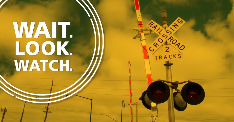 A graphic depicts a rail crossing with the text "Wait. Look. Watch."