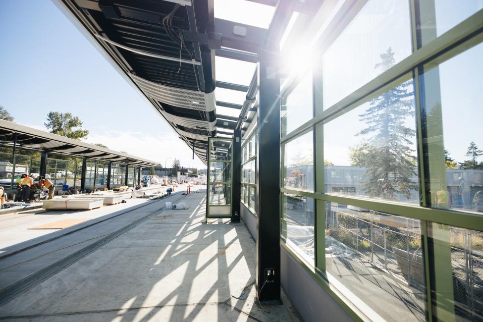 Sunlight shines through glass at the platform of Bel-Red/130th Station.