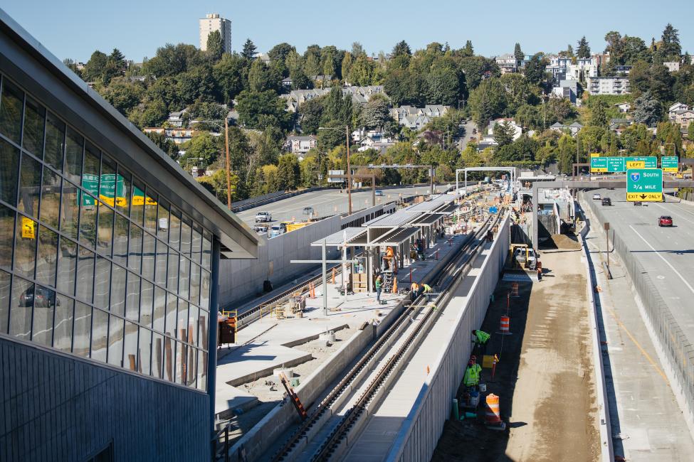 A view of Judkins Park Station looking west. Train tracks are visible, as well as glass windows on the station.