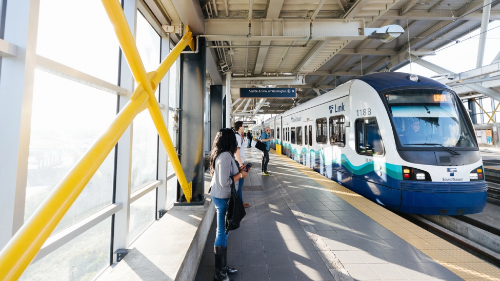 Lynnwood Link project update header, photo of riders waiting to board link light rail
