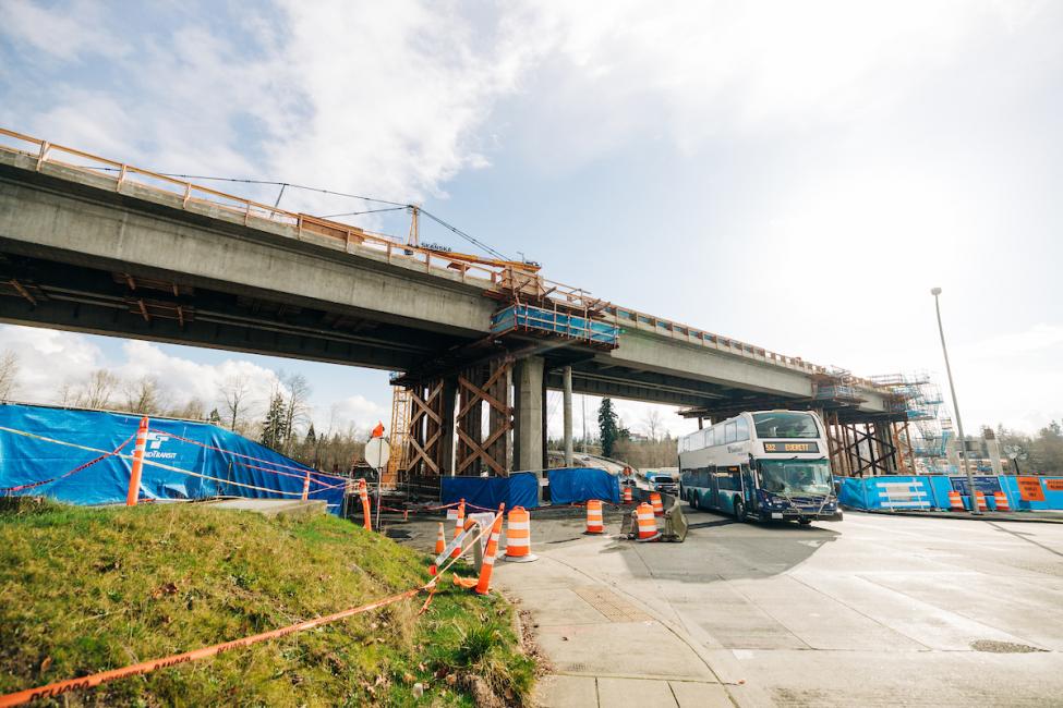 A bus passes under the future light rail tracks at the Lynnwood City Center Station at the Lynnwood Transit Center.