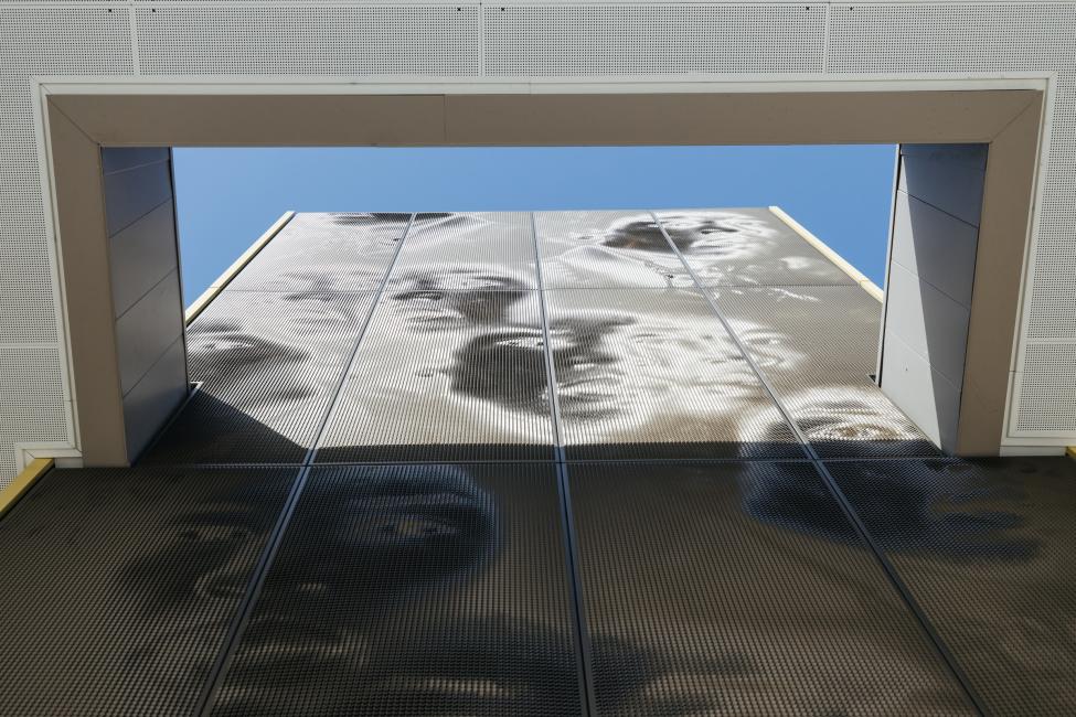 Looking up at the mural featuring Jimi Hendrix provides a different perspective. It's more difficult to make out his face from this angle.