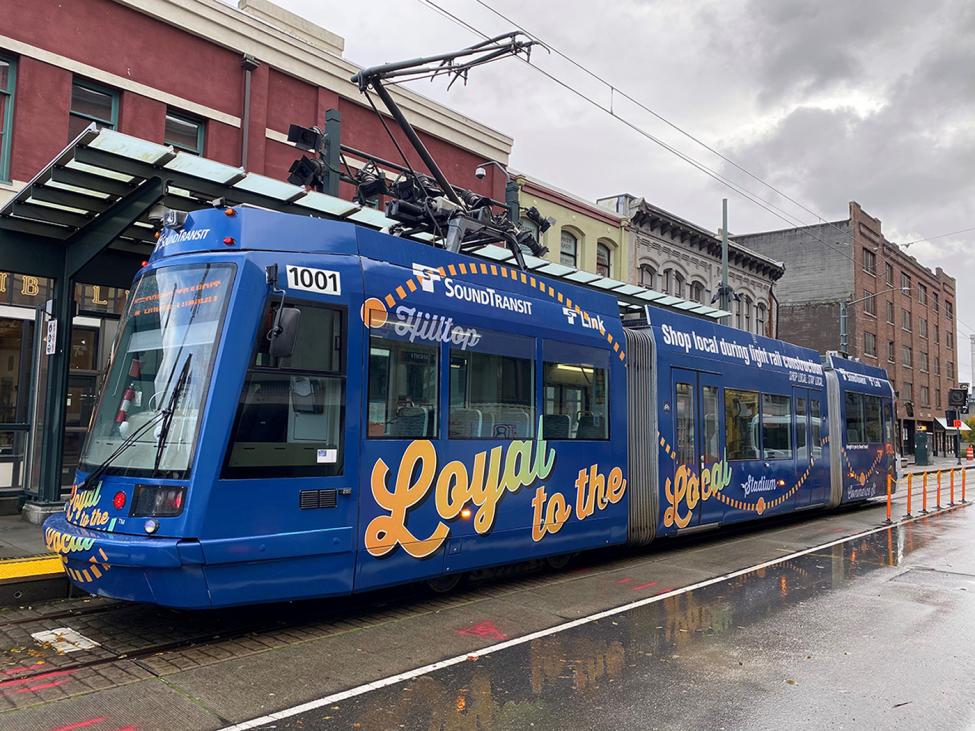 Photo of Tacoma Link showing a Loyal to the local train wrap, Hilltop Tacoma Link Extension