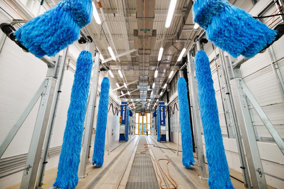 Trains are washed in this facility, which looks similar to a car wash.