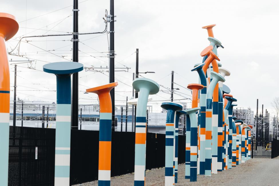 The art at the new OMF is a freestanding sculpture of large nails painted in shades of blue and orange.
