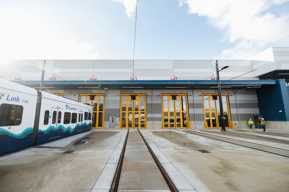A Link train is parked in front of the new Operations and Maintenance Facility.