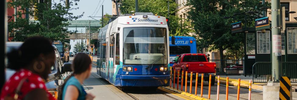 Tacoma Link light rail vehicle arriving at a station